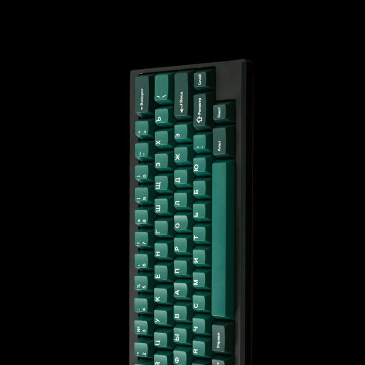 Keyboard on a natural background with leaves and grass