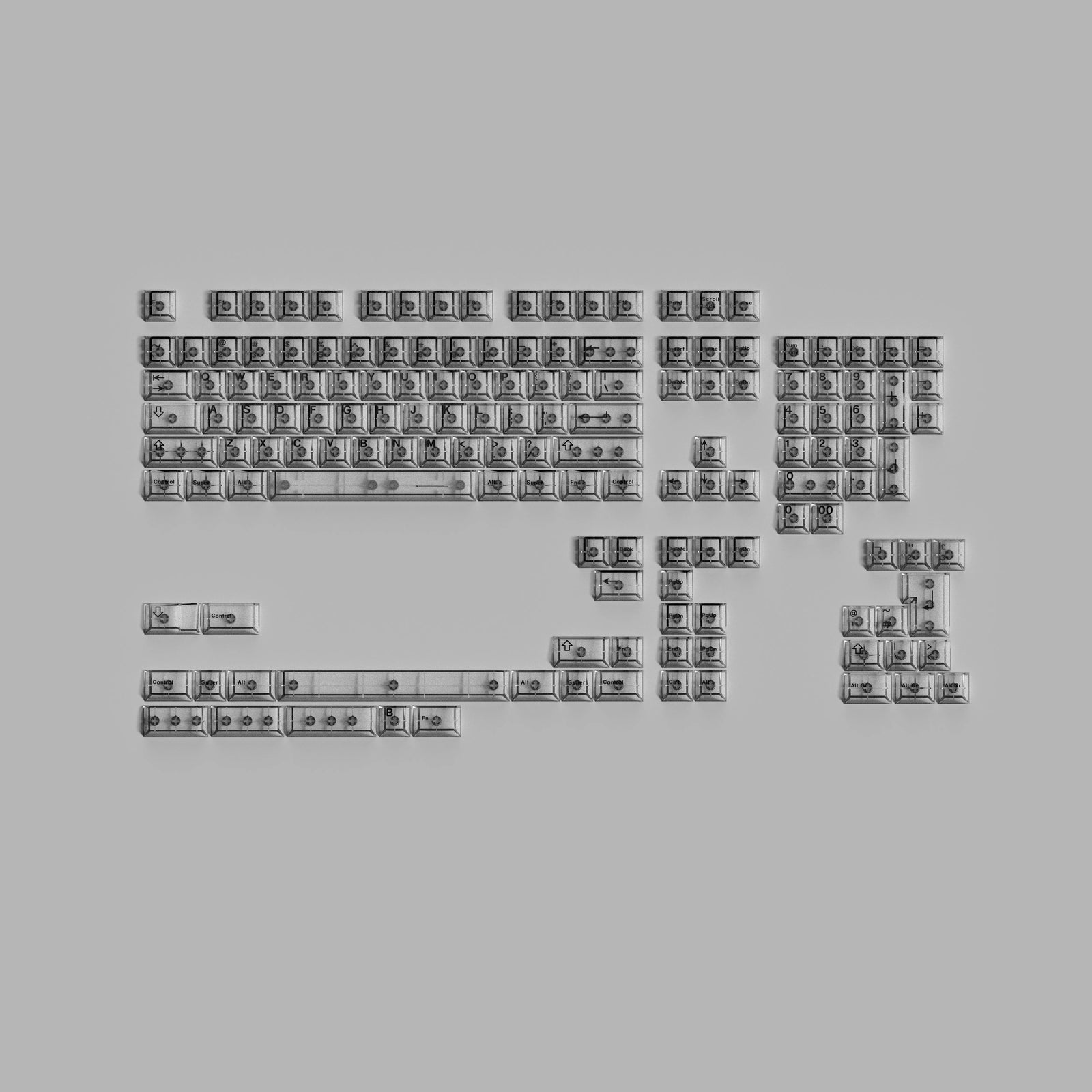 Keyboard keys arranged in a scattered pattern on a gray background