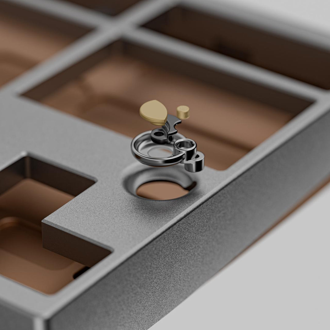 Close-up of a silver ring with yellow gemstones on a textured surface - neo80 keyboard