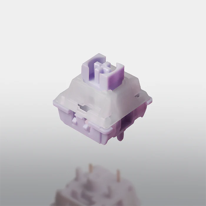 Mechanical keyboard switch with purple and white design on a light gray background